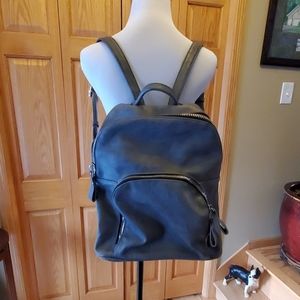 Gray backpack purse with large zippers